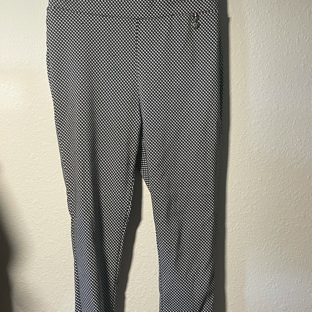 Houndstooth patterned pants.
